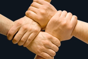 Image of crossed hands isolated over blue background